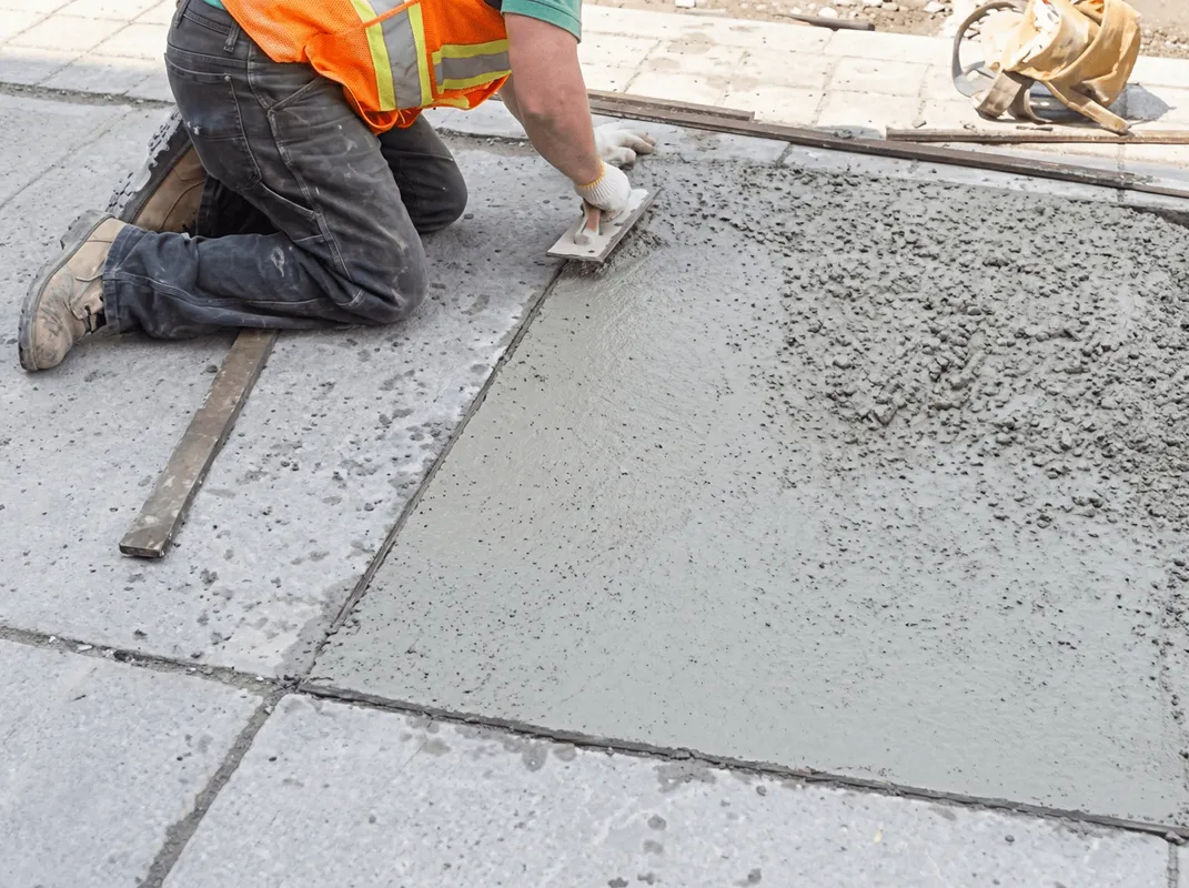 Professional repairing a concrete floor in Austin, TX